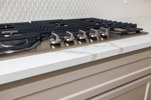 a close up of a stove top oven sitting on a floor