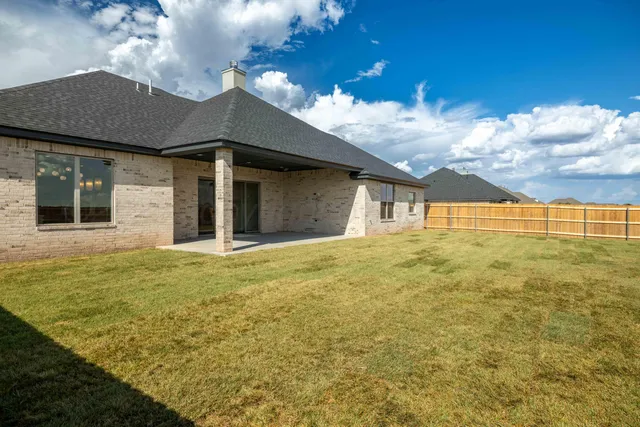 a house view with swimming pool in front of it
