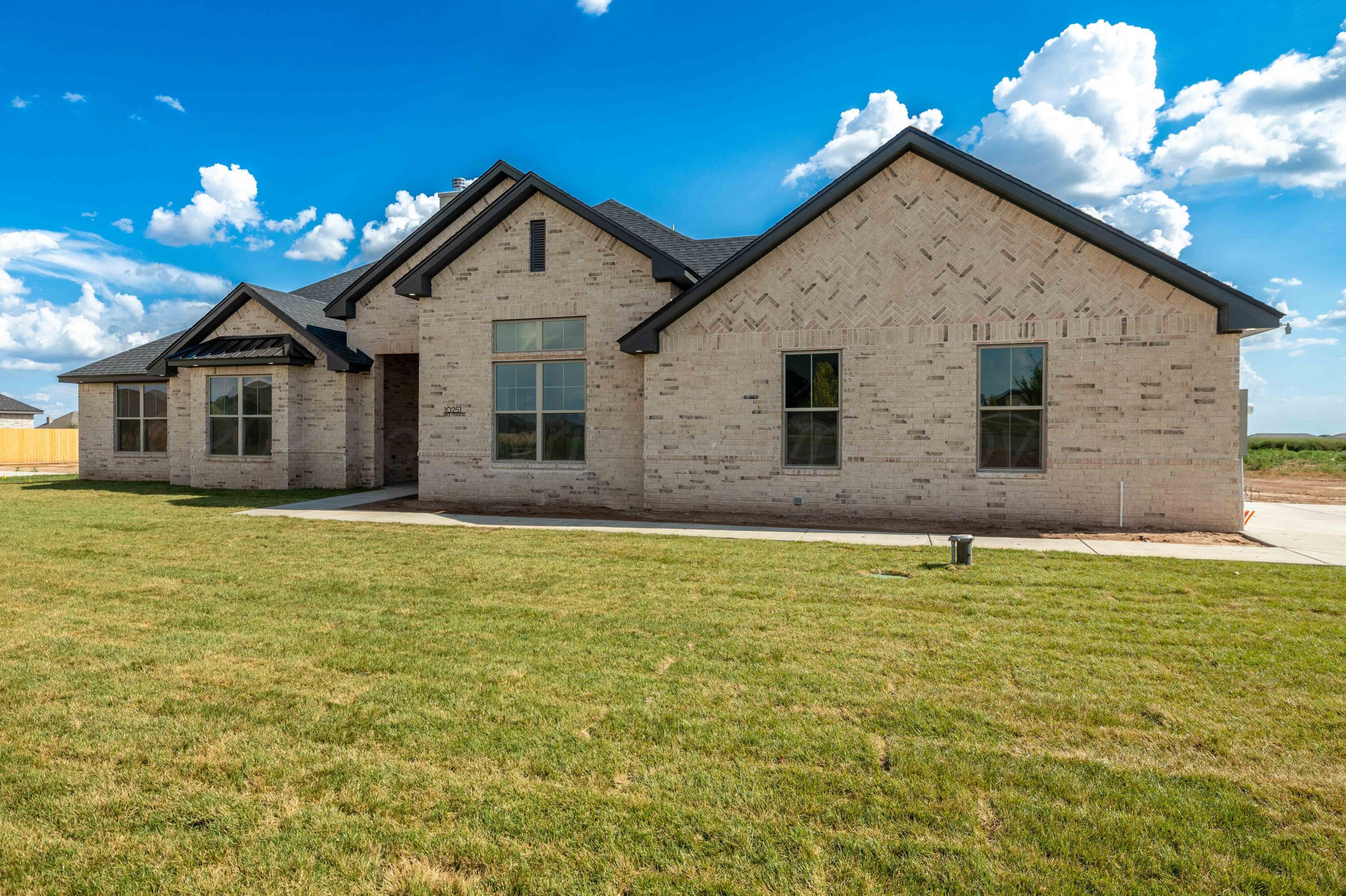 10251 Prickly Pear Road Amarillo, TX 79119 - Photo 8 of 30 a view of a house with a yard
