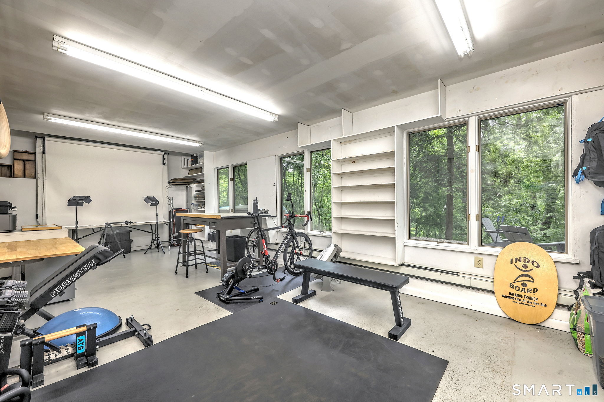 95 Thankful Stow Road Guilford, CT 06437 - Photo 31 of 40 Heated lower level rec room/gym/office/studio with walkout.