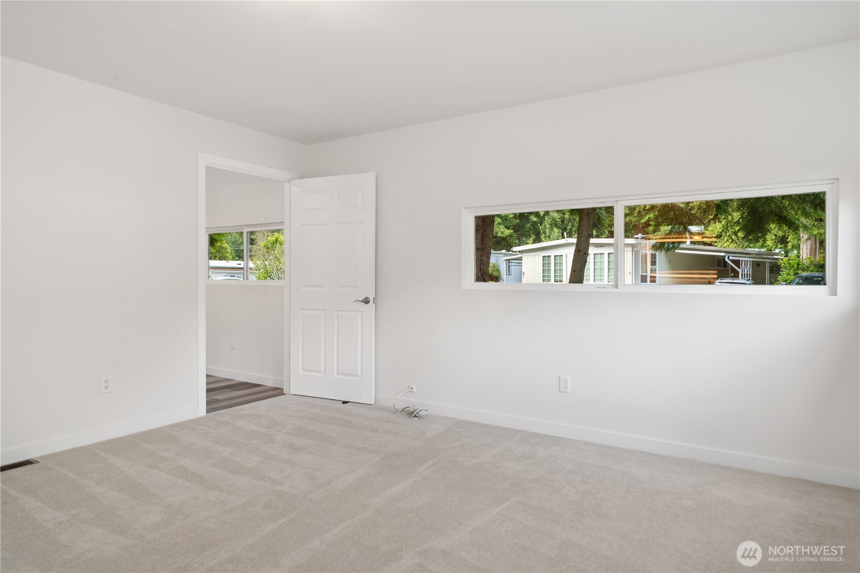 16300 Northeast State Highway, Unit 10 Poulsbo, WA 98370 - Photo 11 of 34 an empty room with windows