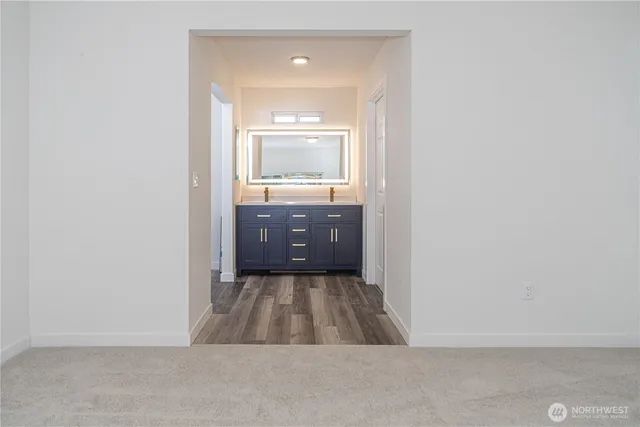 a bathroom with a sink and mirror