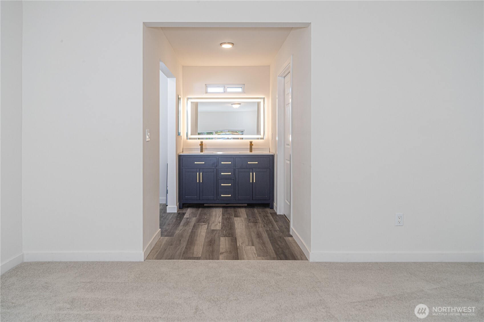 16300 Northeast State Highway, Unit 10 Poulsbo, WA 98370 - Photo 12 of 34 a bathroom with a sink and mirror
