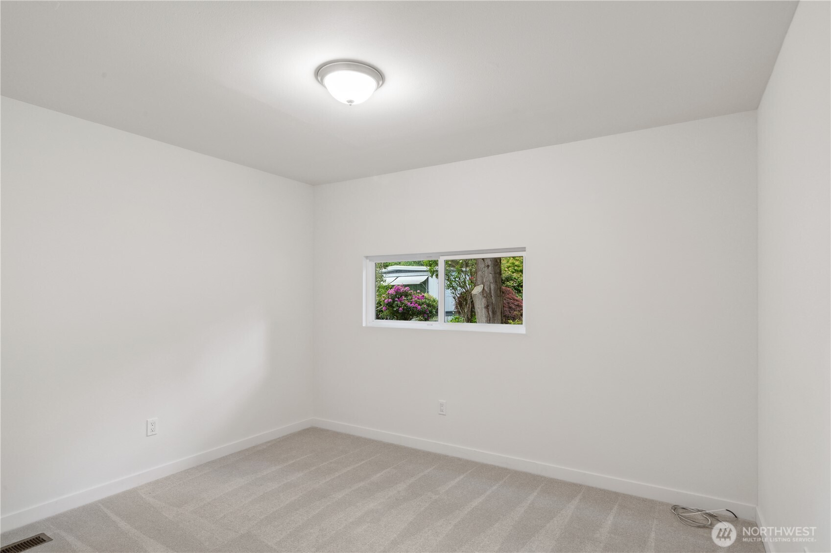 16300 Northeast State Highway, Unit 10 Poulsbo, WA 98370 - Photo 16 of 34 an empty room with windows