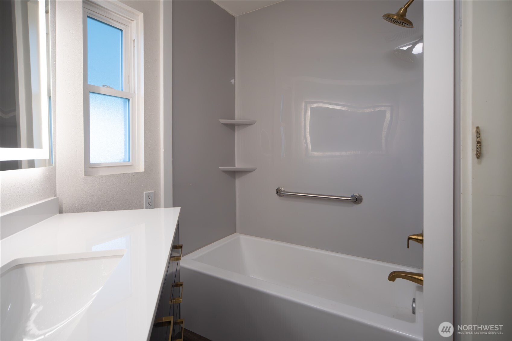 16300 Northeast State Highway, Unit 10 Poulsbo, WA 98370 - Photo 18 of 34 a bathroom with a bathtub and window