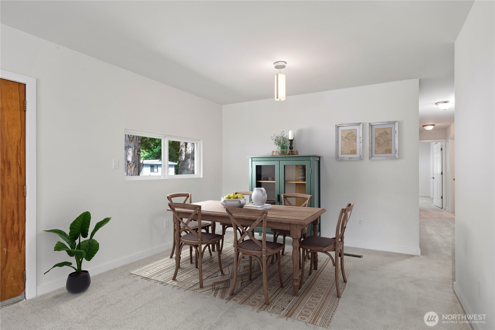 16300 Northeast State Highway, Unit 10 Poulsbo, WA 98370 - Photo 6 of 34 a view of a dining room with furniture and a potted plant