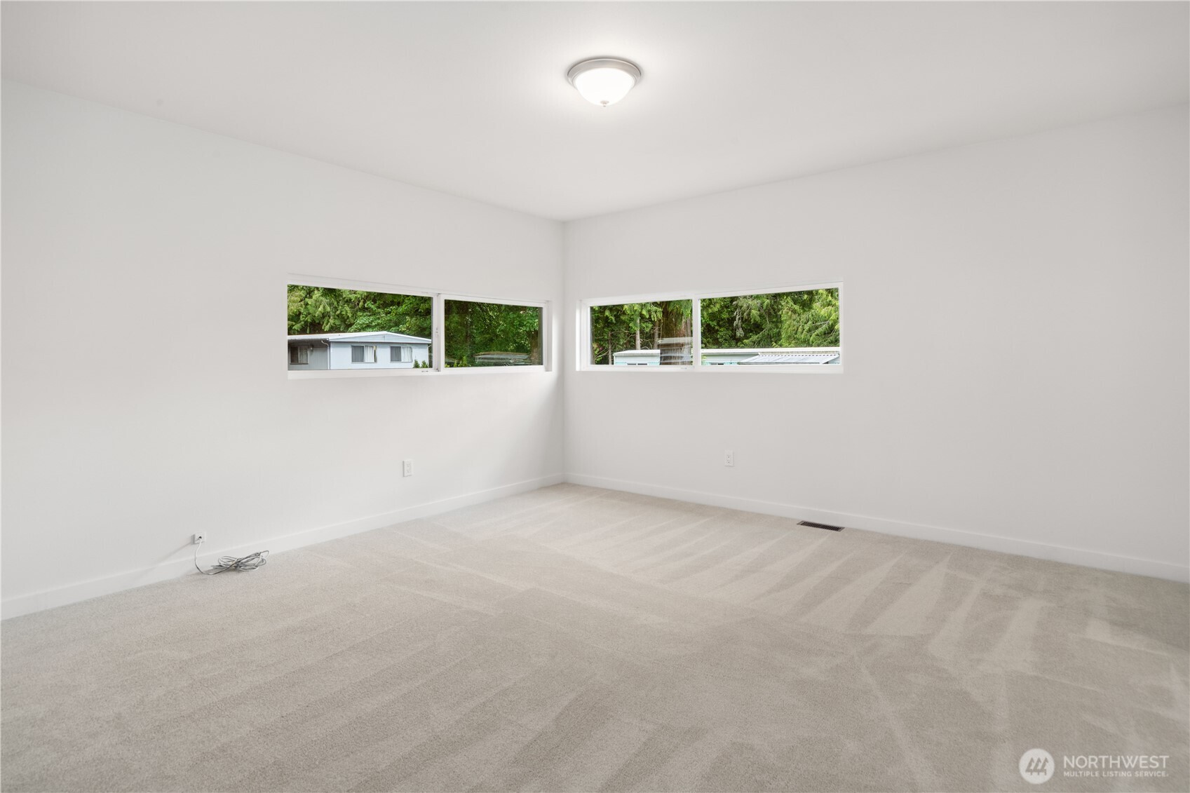 16300 Northeast State Highway, Unit 10 Poulsbo, WA 98370 - Photo 10 of 34 an empty room with windows