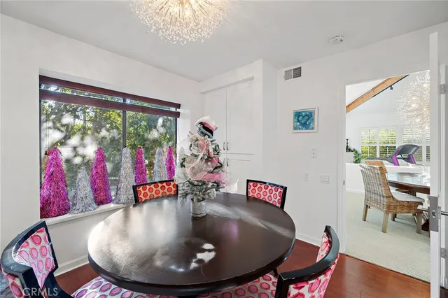 a workspace with furniture window and wooden floor