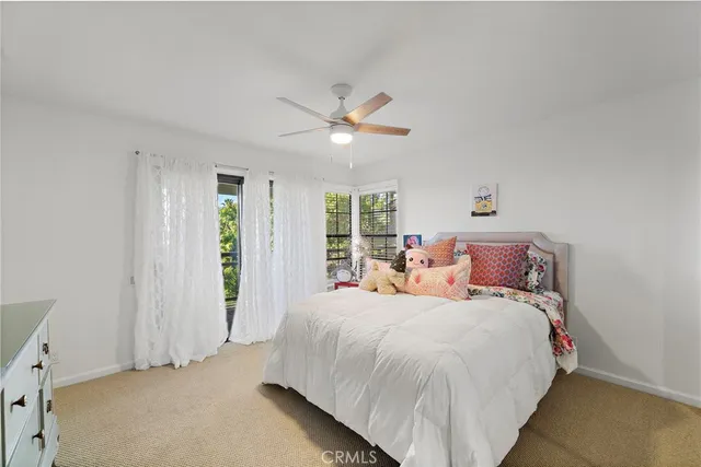 a bedroom with bed and window
