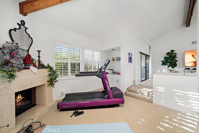 a bedroom with furniture and a fireplace