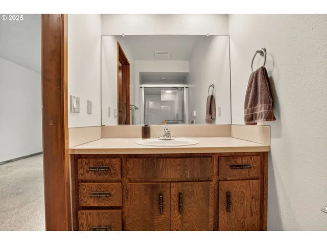 a view of a bathroom with a glass door