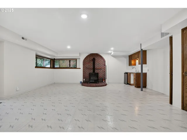 a kitchen with stainless steel appliances granite countertop a sink and cabinets