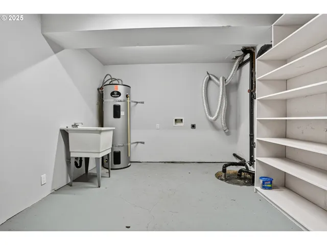 a view of a tree in front of a house with a yard