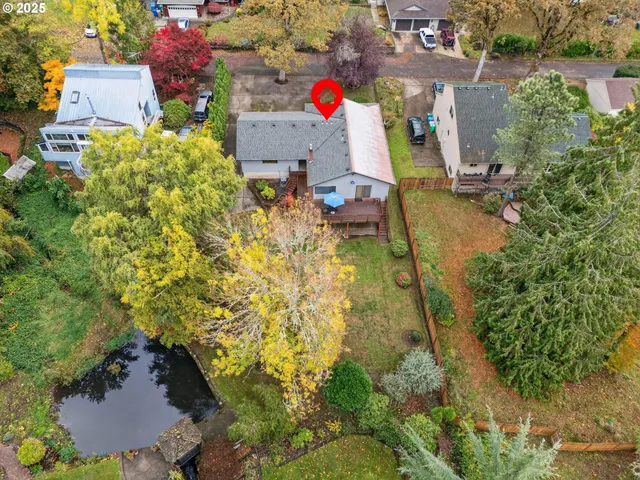 a backyard of a house with outdoor seating
