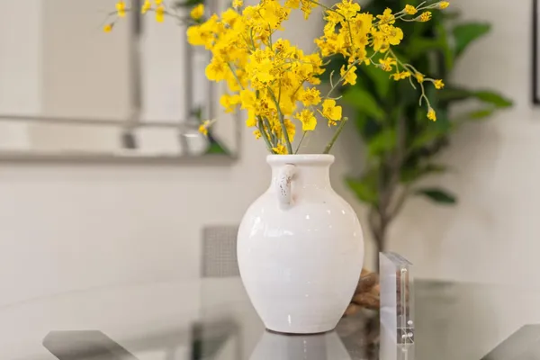 a vase of flowers sitting on a table