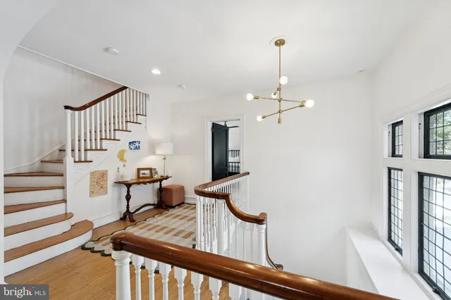 a view of a room with furniture and wooden floor