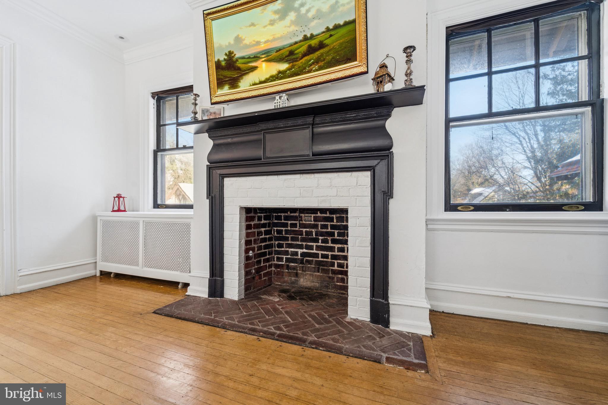 1221 Church Road Wyncote, PA 19095 - Photo 19 of 51 a view of an empty room with wooden floor and a window