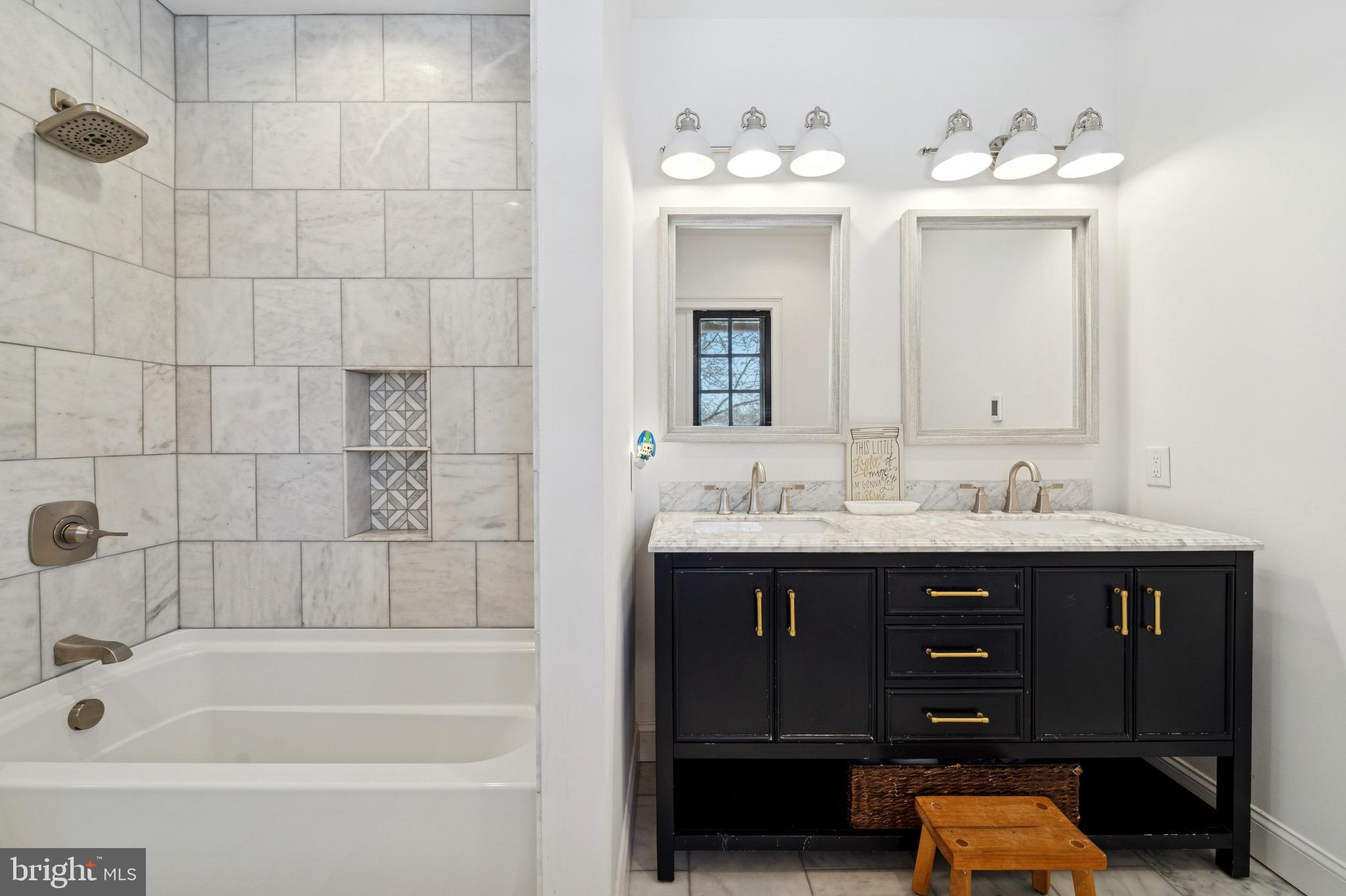 1221 Church Road Wyncote, PA 19095 - Photo 22 of 51 a bathroom with a tub sink and mirror