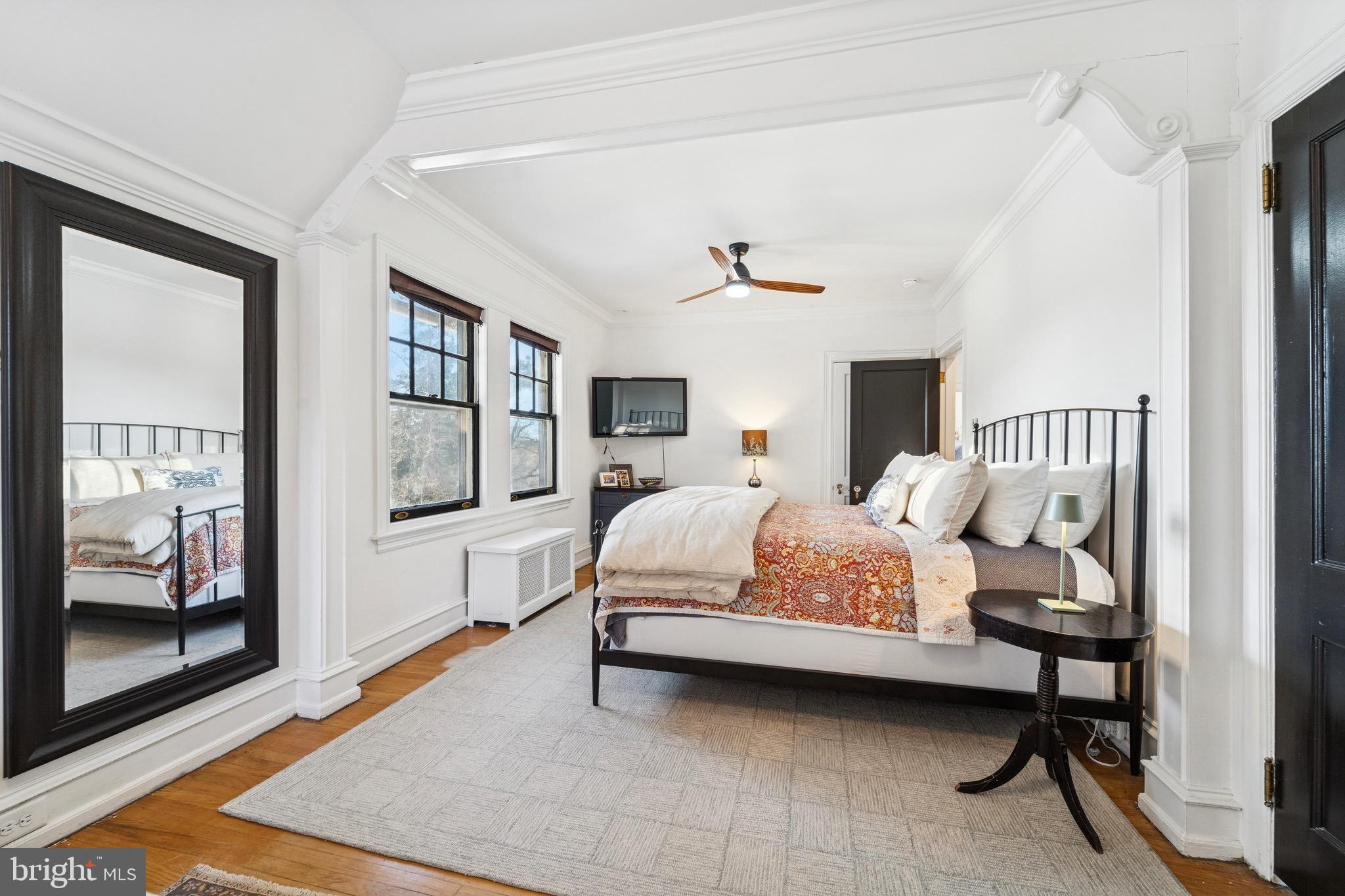 1221 Church Road Wyncote, PA 19095 - Photo 27 of 51 a bedroom with a bed a mirror and furniture