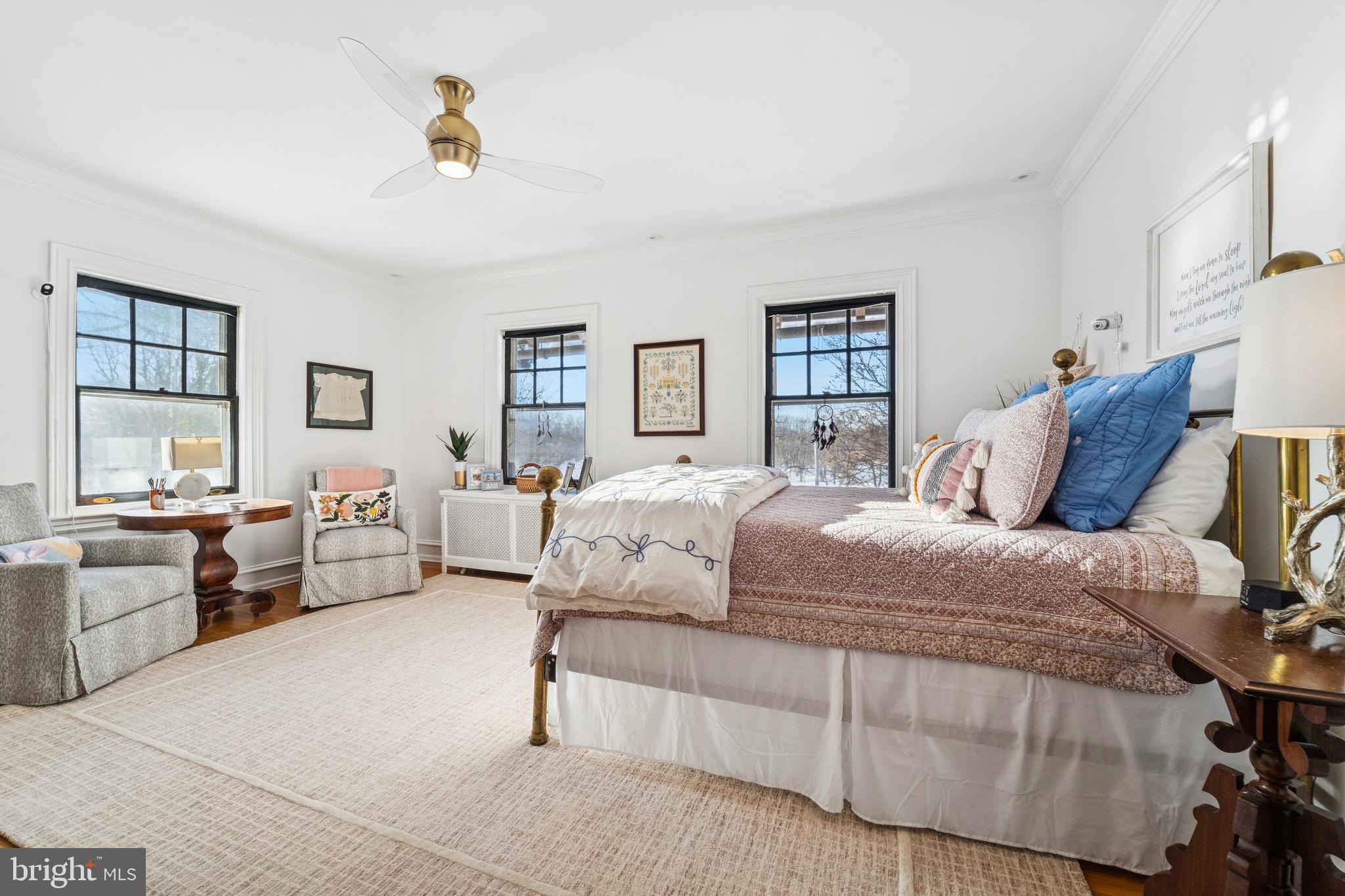 1221 Church Road Wyncote, PA 19095 - Photo 30 of 51 a spacious bedroom with a large bed and a chandelier