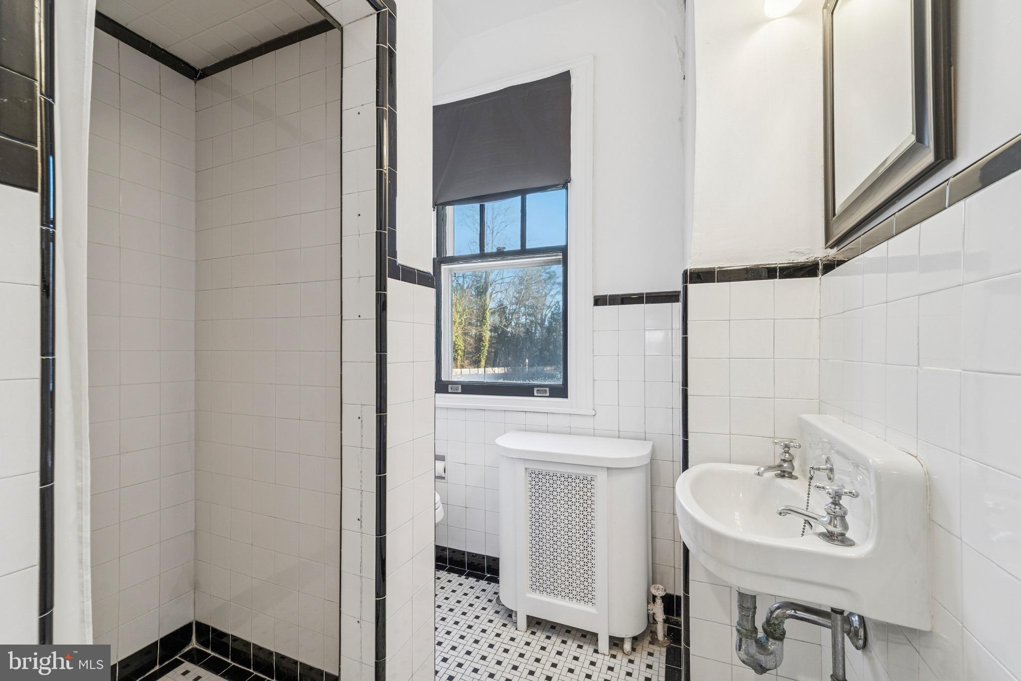 1221 Church Road Wyncote, PA 19095 - Photo 32 of 51 a bathroom with a sink and a mirror
