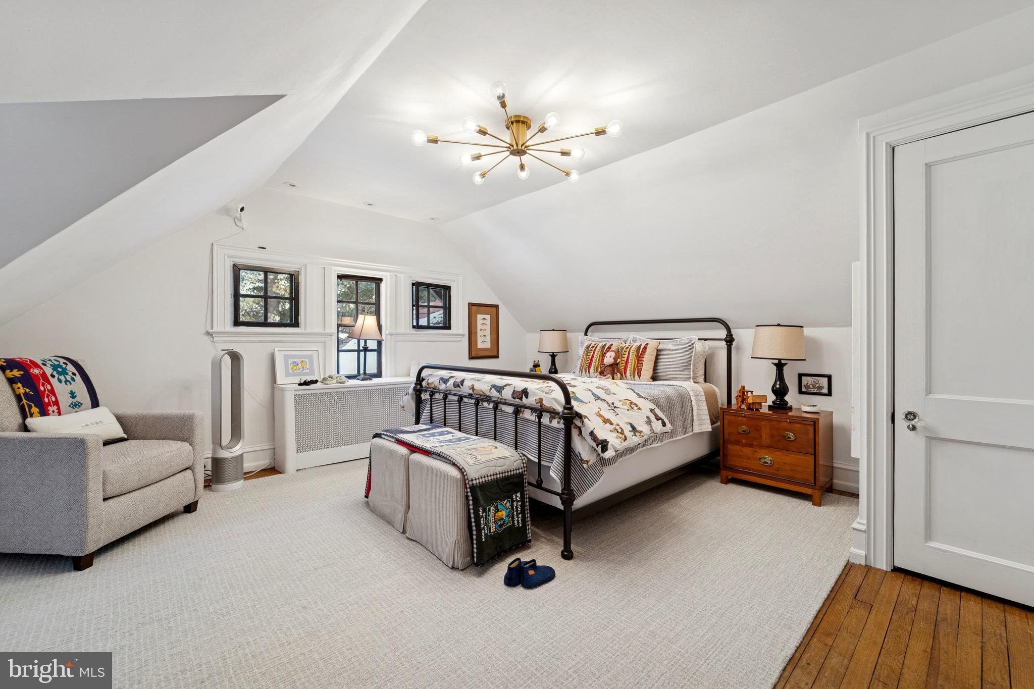 1221 Church Road Wyncote, PA 19095 - Photo 33 of 51 a bedroom with a bed and a chandelier