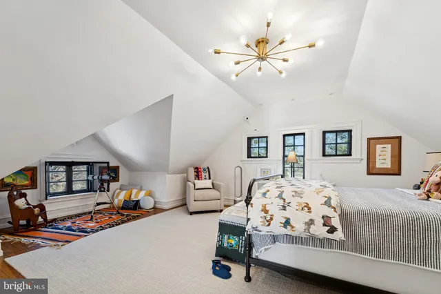 a view of a livingroom with workspace and a couch