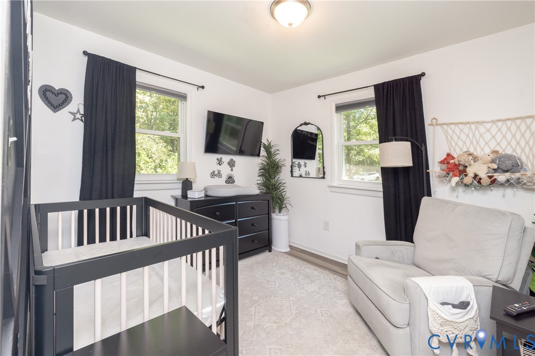 1722 Maidens Road Maidens, VA 23102 - Photo 10 of 21 Bedroom with a crib and light wood-style floors