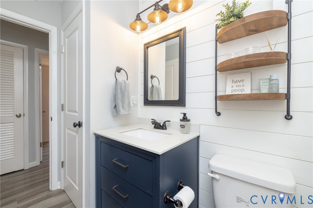 1722 Maidens Road Maidens, VA 23102 - Photo 14 of 21 Half bathroom featuring vanity and wood finished f