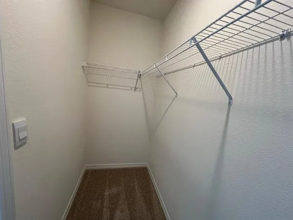 a view of a room with racks on the wall