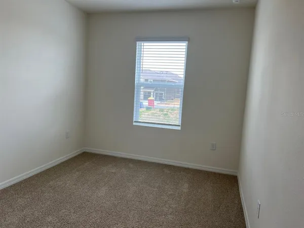 an empty room with door