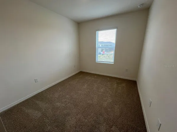 a white toilet sitting next to a bath tub
