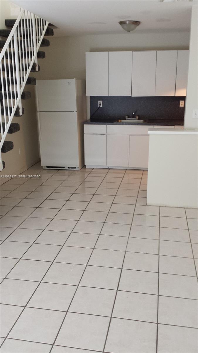 3901 Southwest 109th Avenue, Unit 6 Miami, FL 33165 - Photo 11 of 12 a kitchen with a sink and cabinets