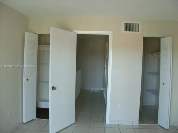 a view of a hallway with some storage area