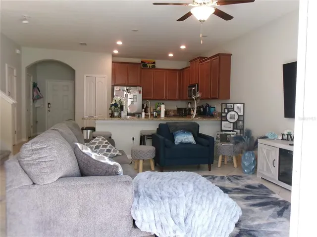 a large bedroom with furniture and a chandelier