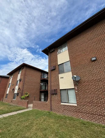 a backyard of a house with lots of green space and garden