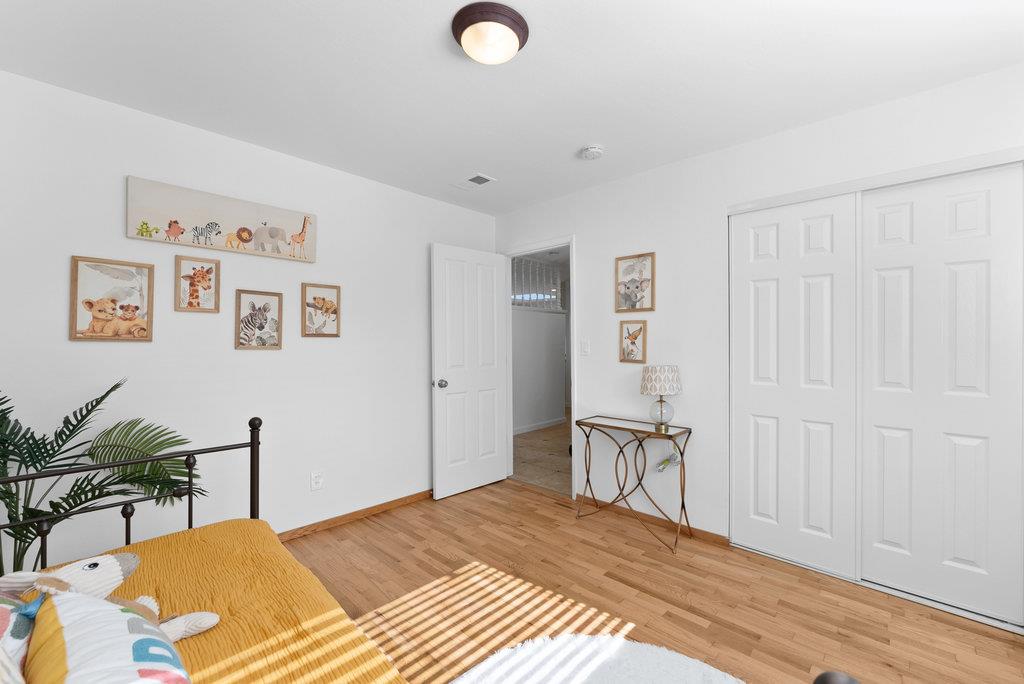 135 Baltusrol Drive Aptos, CA 95003 - Photo 19 of 32 a bedroom with a bed and furniture