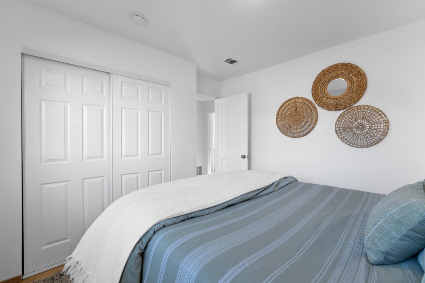 135 Baltusrol Drive Aptos, CA 95003 - Photo 20 of 32 a bedroom with a bed and cupboard