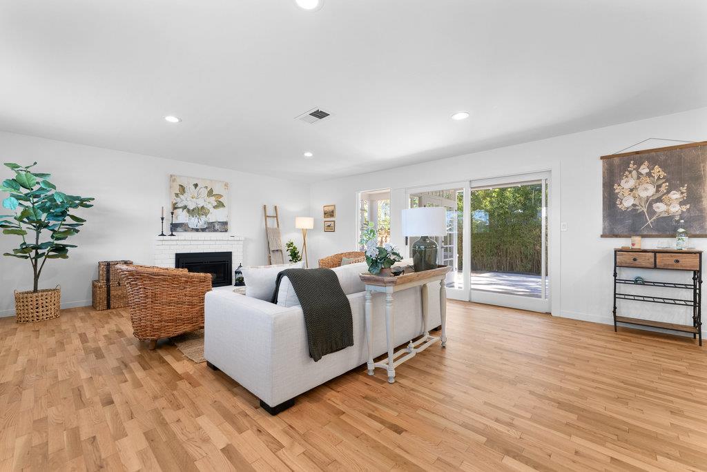 135 Baltusrol Drive Aptos, CA 95003 - Photo 3 of 32 a living room with furniture a fireplace and a potted plant