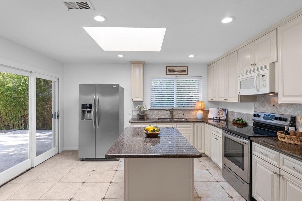 135 Baltusrol Drive Aptos, CA 95003 - Photo 5 of 32 a kitchen with refrigerator and window