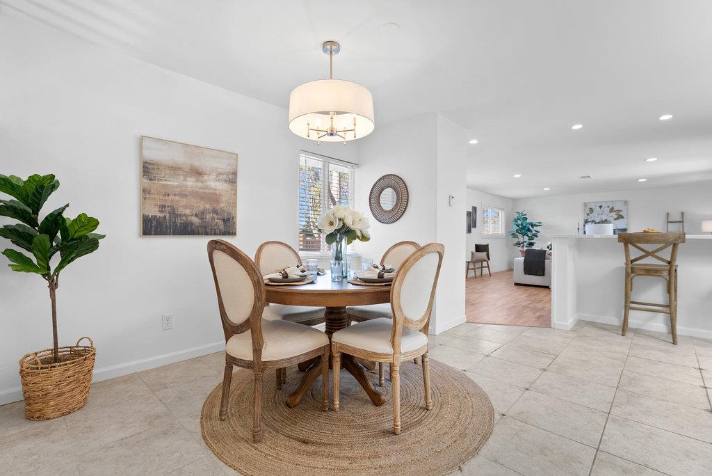 135 Baltusrol Drive Aptos, CA 95003 - Photo 7 of 32 a dining room with furniture and a clock