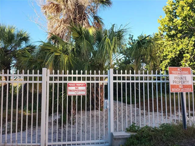 a view of balcony with yard and outdoor seating