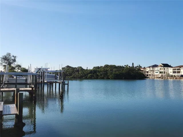 a view of a lake with houses in background