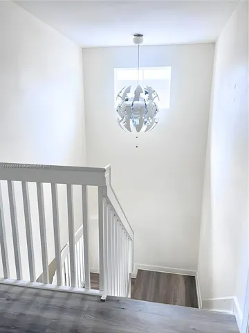 a view of hall way with fireplace