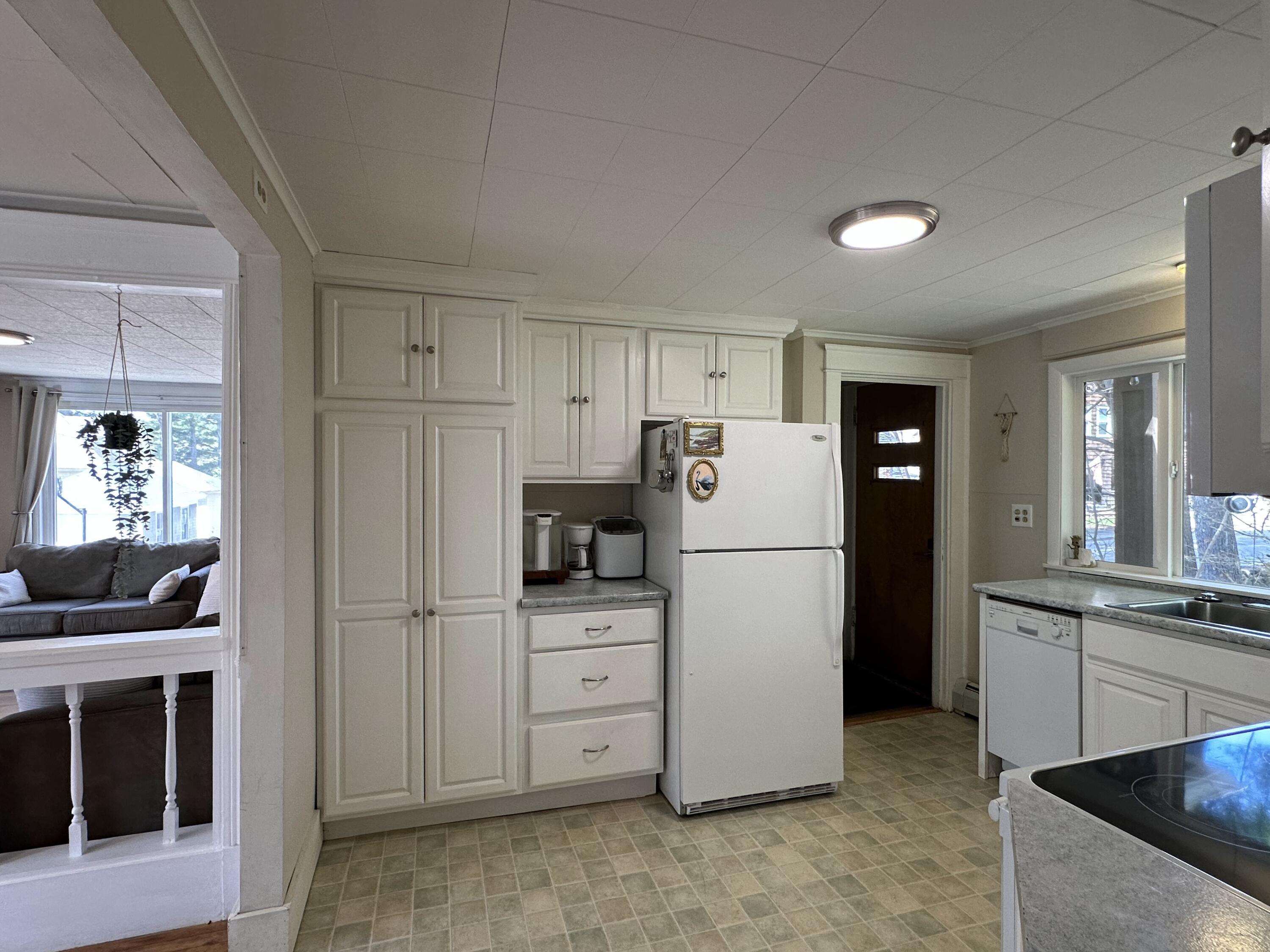 94 Western Promenade Auburn, ME 04210 - Photo 13 of 54 Kitchen into living room