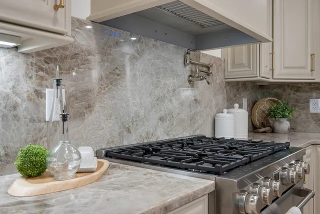 a kitchen with a stove and cabinets