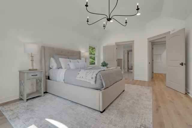 a view of empty room with a window and closet