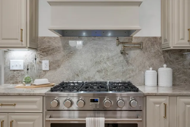 a dining room with furniture and a chandelier