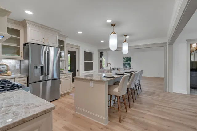 a view of a dining room with furniture and wooden floor