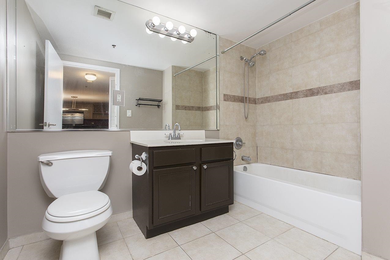700 1st Street, Unit 4L Hoboken, NJ 07030 - Photo 5 of 9 a bathroom with a sink a toilet and shower